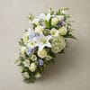 White floral spray with roses, lilies, calla lilies, and hydrangeas