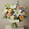 Sympathy bouquet with white lilies, roses, and carnations