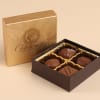 Box of assorted chocolates in a gold and brown gift box