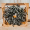 Wooden crate filled with dried eucalyptus branches