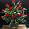 Hand selected red roses and eucalyptus arrange with artistry,creating a sophisticated and