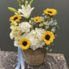 A stunning arrangement of blue,white,and yellow flowers thoughtfully designed to bring beautybrightness