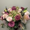 Bouquet of pink and magenta roses with hydrangea and protea