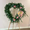 "A funeral heart of Garden Roses, carefully designed to convey elegance and