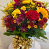 Mixed bouquet with a red rose and yellow sunflowers in a gift box