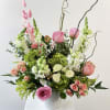 Discover the free-spirited charm of Boho Peach, a whimsical bohemian flower arrangement