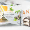 Wrapped coconut lime chocolate bar with a bitten piece beside it