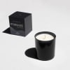 Black candle in a glass jar with a matching box