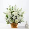 Let this exquisite composition of beautiful white blossoms deliver your sympathy and