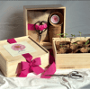 Wooden gift boxes with seedling pots, ribbon, and scissors
