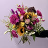 A vibrant, textured arrangement that captures the wild elegance of a Southern