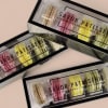 Gift box containing 5 Macarons: Coffee, Raspberry, Lemon, Vanilla, and Pistachio. 
Enjoy