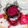 Bouquet of hot pink roses with a teddy bear and heart-shaped gift boxes