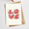 Greeting card with the word Love in pink floral letters