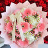 Pink and white bouquet with gerbera daisies, roses, and a ribbon bow