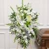 This standing spray is a striking and elegant tribute, featuring a lush