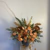 warm tones combined with fall flavor. This arrangement is designed to bring