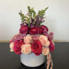  mix of garden roses and ranunculus in varying shades of pink