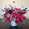 bright pink roses combined with soft pink spray roses and wild berries.
