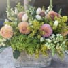 pink dahlias and white tulips in a field of soft greens 