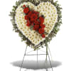 Heart-shaped floral standing spray with red and white flowers