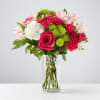 Bouquet of pink and white flowers in a clear glass vase