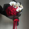 Red rose bouquet with white orchids wrapped in black paper and a red ribbon