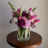 A lively garden-style bouquet in pinks, blush, white and soft purples that