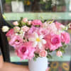 Pink and white bouquet in a white vase