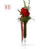 Tall red rose arrangement in a clear glass vase with trailing red flowers