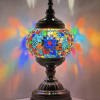 Colorful mosaic table lamp with a dark metal base