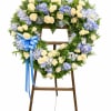This graceful sympathy heart easel is designed in soothing shades of soft
