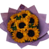 Bouquet of sunflowers wrapped in purple paper
