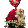 Red rose arrangement with a heart balloon, teddy bear, and chocolates in a basket