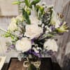 This arrangement is sure to please the eye and heart. 

Roses, Lilies