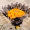 Bouquet of yellow roses with a jeweled crown topper