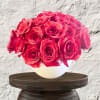 Bouquet of red roses in a white vase