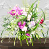 "Hand-crafted by accredited Master Florist Tricia Won (AIFD, EMC, IMF) using premium