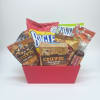 Gift basket with assorted snack packages in a pink container