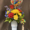Bouquet of red roses and yellow flowers in a blue tumbler with a teacher balloon