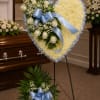 Heart shape with a  mixture of fuji mums, white roses, baby's