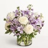 Lavender and white bouquet in a clear glass vase