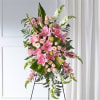 Tall pink and white floral standing spray on an easel