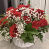 Red roses and baby's breath in a white basket
