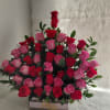 A unique classic,  and elegant floral arrangement made whit red and