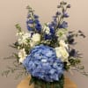 A lush blue hydrangea takes center stage in this Blue Haze flower