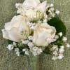 White rose and calla lily boutonniere with baby's breath