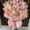 Pale pink and white roses mingled with fresh pink tulips create a