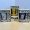 Three boxed flower pot mug gift sets with colorful mugs and matching saucers