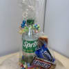 Gift bag with a Sprite bottle and assorted candy bars wrapped in clear cellophane